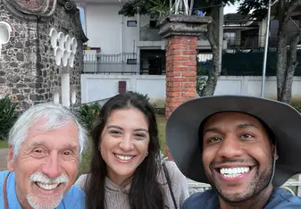 three people smiling 