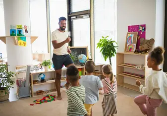 Teacher playing Simon Says with kids