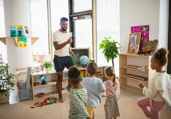 Teacher playing Simon Says with kids