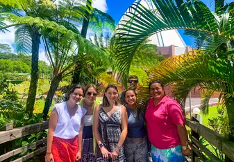 Students pose in front of a Bahai Temple