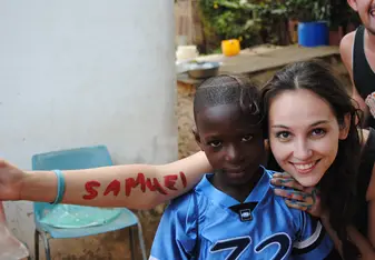 Teacher with students in Ghana