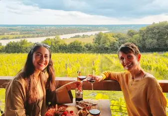 Enjoying at a vineyard restaurant while practicing French during an immersion experience in southwest France