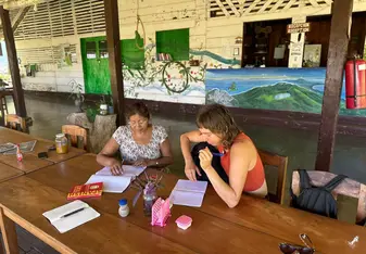 A women studying with local teacher