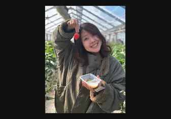 Yoshimi Hufford picking strawberries in Japan
