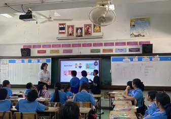 Teacher teaching Infront of the class