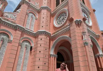 Standing in front of a clocktower in Ho Chi Minh City