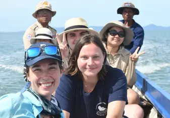 Interns on boat survey