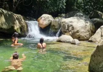 Ritmo del Río Spanish School students enjoying the crystal-clear river that runs through or Ecolodge