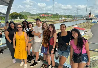 Group of students visiting the Panama Canal locks during a cultural excursion in their Spanish immersion program.