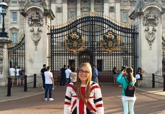 Female intern posing at Buckingham Palace in London!