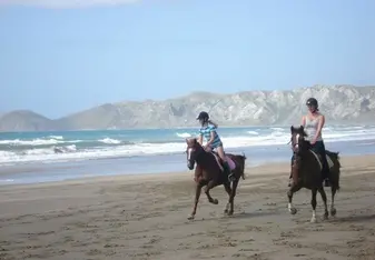 Farmstay girl taking the families daughter for a beach ride