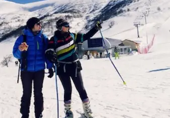 Two people skiing