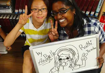 Rathi with one of her students in South Korea
