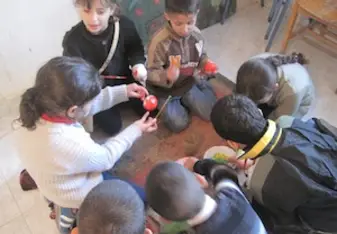 Kids getting creative in class in Palestine