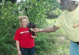 Study in Belize alum Leah with monkey