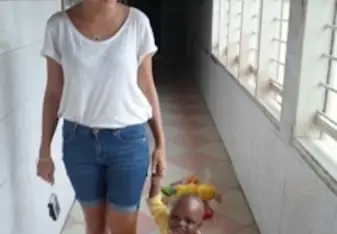Woman walking with a baby