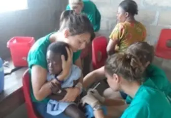 Woman helping a child