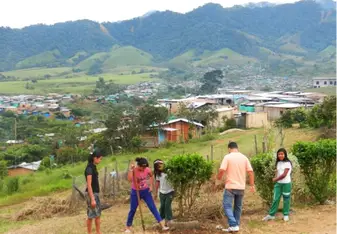 Students planting trees in the heart of the community.