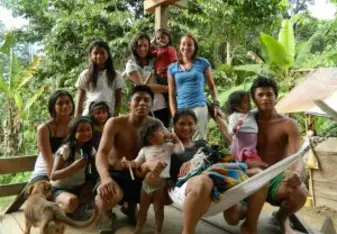 A volunteer and Bethan with some members of the host family.