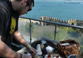 Niko pouring Turkish tea in Istanbul