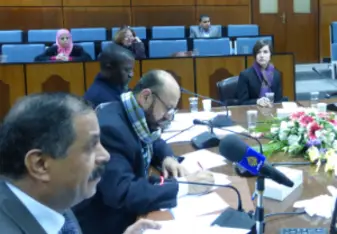 student sitting in on government meeting