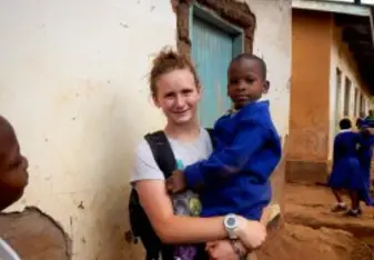 Violet Kyrshak and a student in Tanzania.