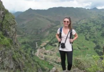 Anna on a hike to the Pisaq Incan Ruins and the town of Pisaq below.