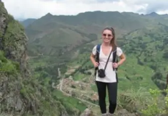 Anna on a hike to the Pisaq Incan Ruins and the town of Pisaq below.