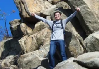 man rock climbing in vietnam