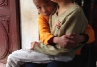Two of the kids hugging when one had a bad day