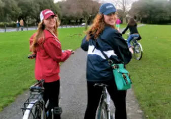 two girls biking phoenix park ireland