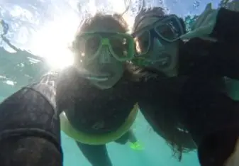 girls snorkeling underwater 