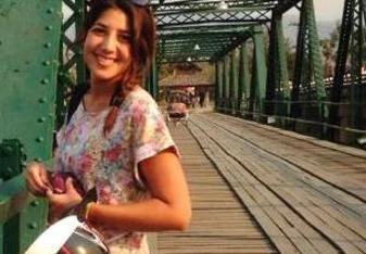 A young girl posing for a picture.