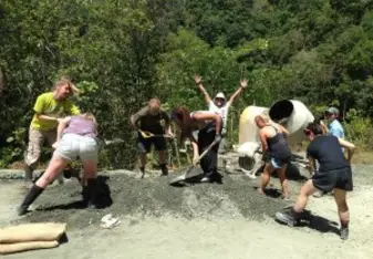 Volunteers on construction site. 