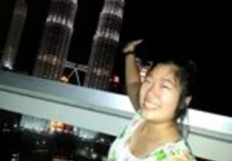 Riri at Malaysia's Petronas Towers at Night