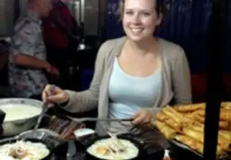 Cassandra cooking street food in HCMC