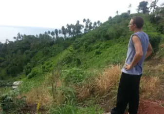 man hiking in the jungle