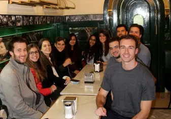 interns smiling at Chocolateria San Gines madrid