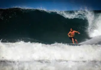 man surfing in Nosara Costa Rica