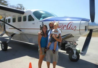 family boarding a plane