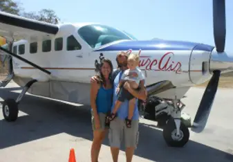 family boarding a plane