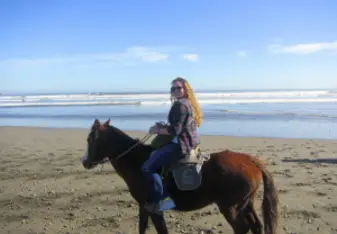 A young woman on a horse.