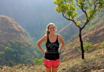 girl hiking and smiling