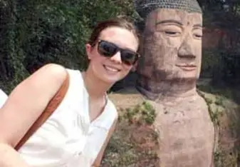 girl with buddha statue