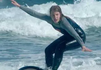 female surfing