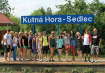 travel group waiting by train 