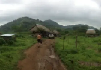 dirt road entrance to camp in panama