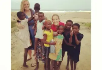 Sierra and a fellow volunteer hanging out at the beach with the kids.