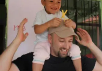 Child sitting on the shoulder