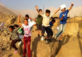 kids jumping off a rock
